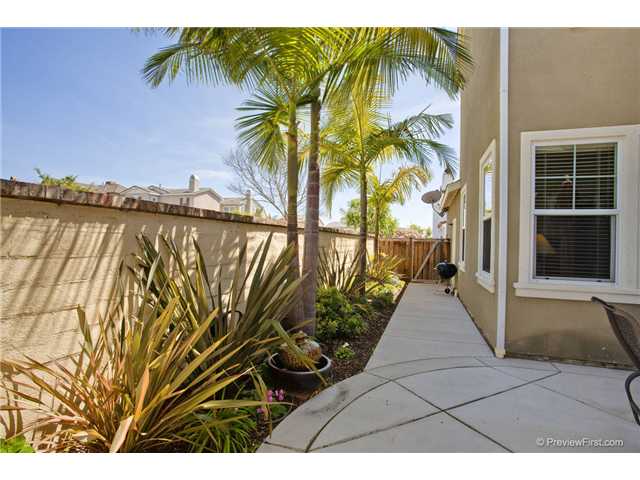 2681 Paradise Road Carlsbad, CA 92009 - Photo 9 of 23 Seller took out and improved slope of the improved cement exterior area and added a walk way around the house-neat enough?