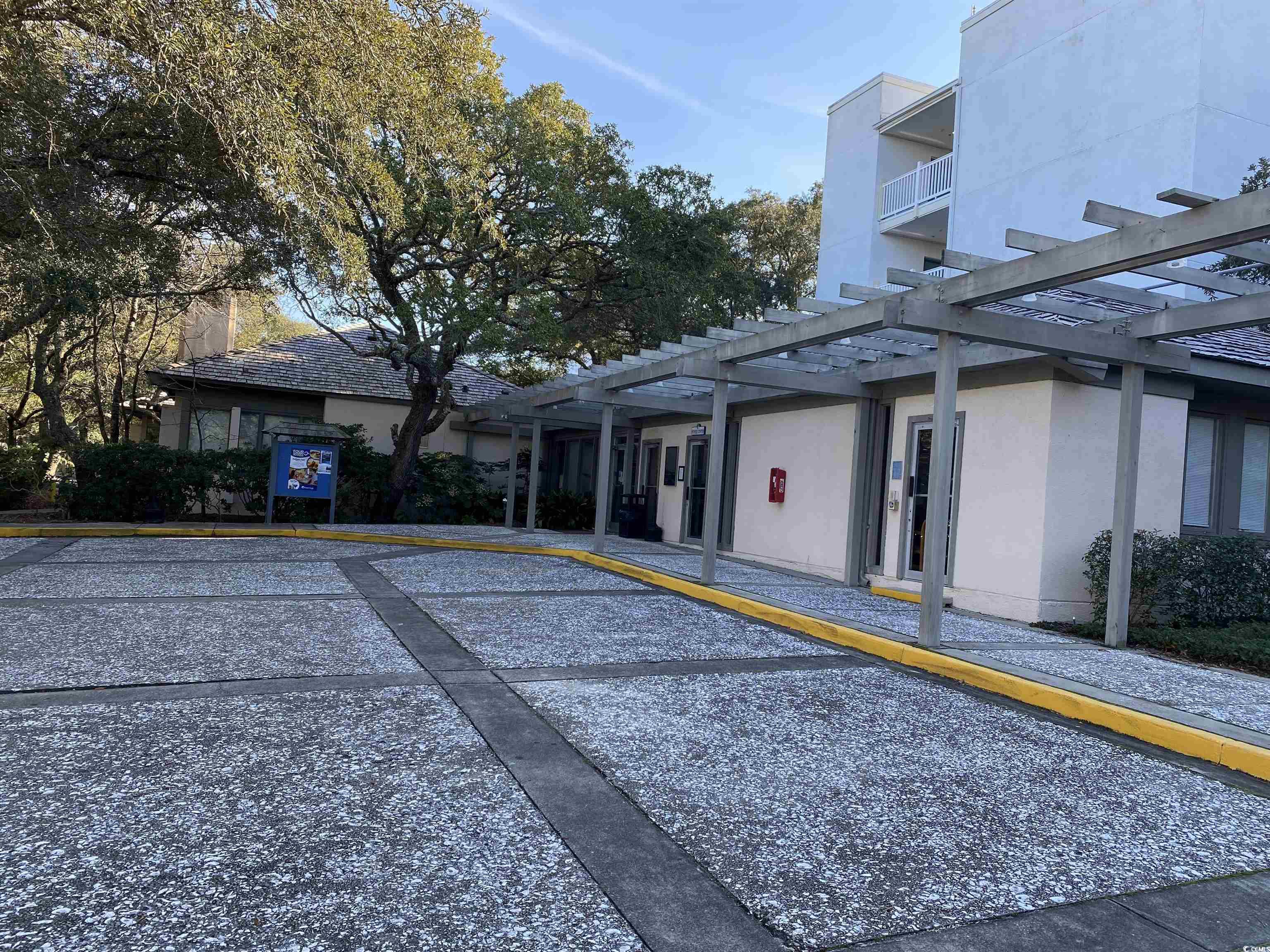 415 Ocean Creek Drive, Unit 2188 Myrtle Beach, SC 29572 - Photo 20 of 28 Indoor community pool featuring a patio area