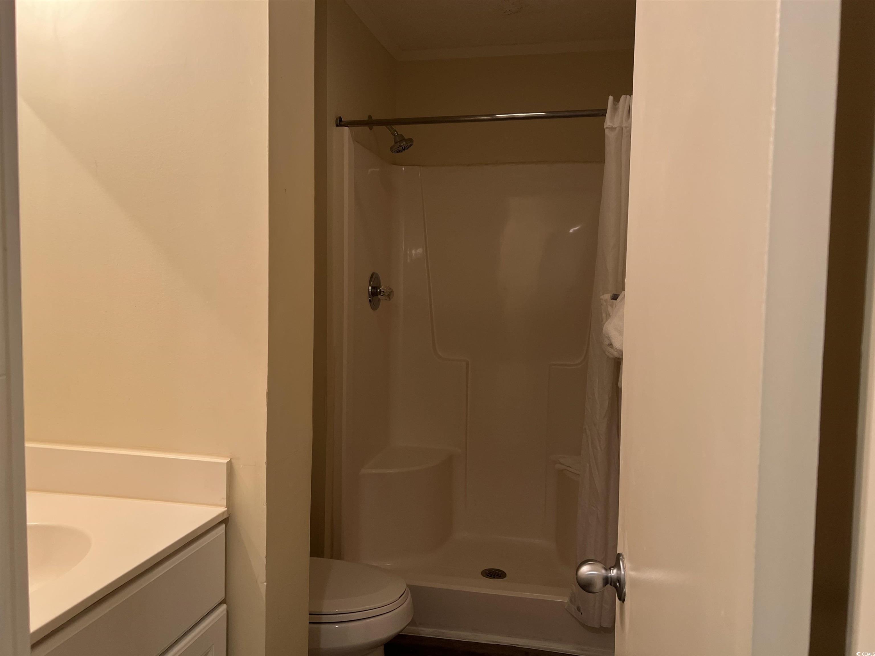 415 Ocean Creek Drive, Unit 2188 Myrtle Beach, SC 29572 - Photo 6 of 28 Bathroom with vanity and a shower stall