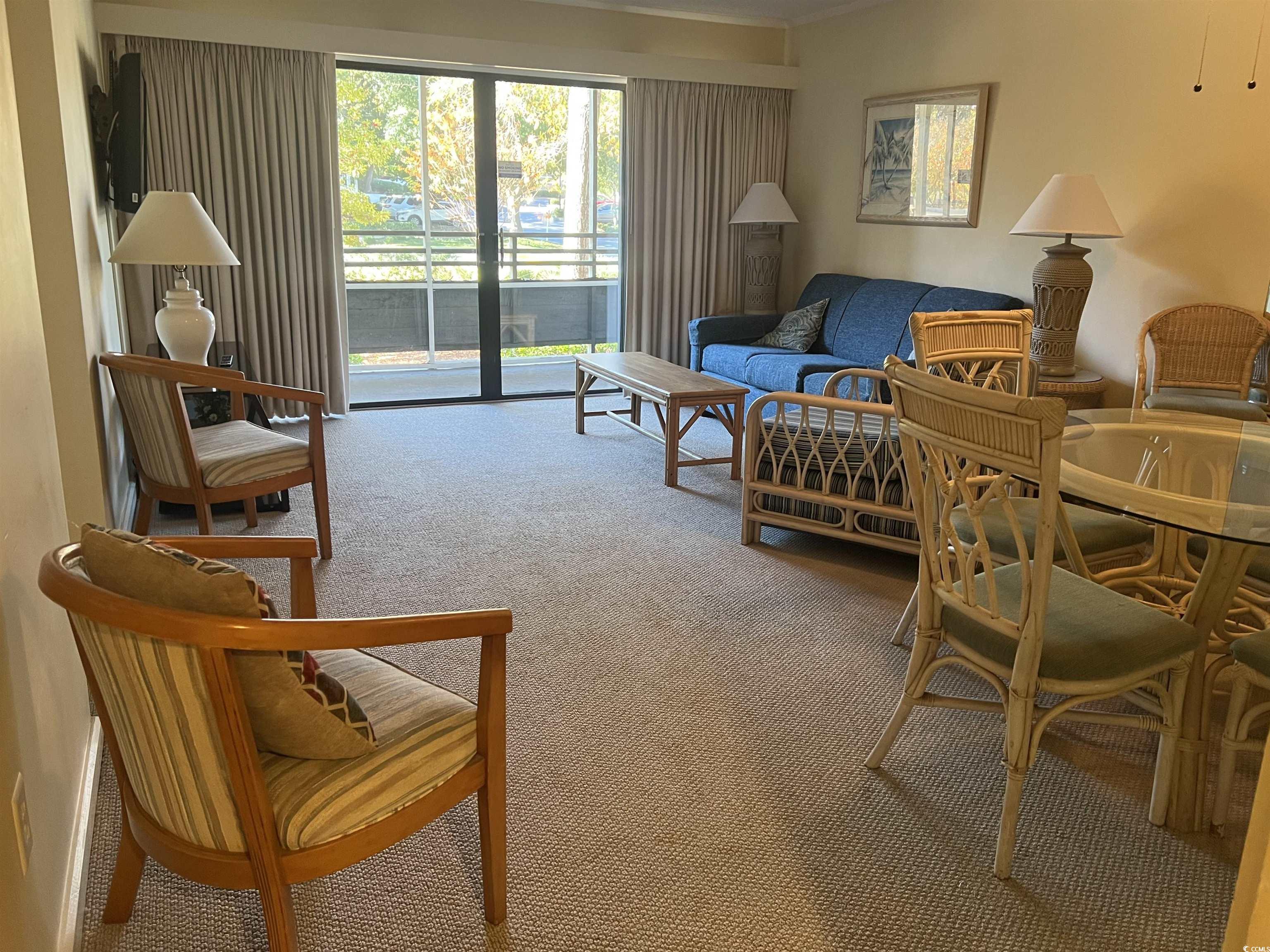 415 Ocean Creek Drive, Unit 2188 Myrtle Beach, SC 29572 - Photo 9 of 28 Living room featuring carpet flooring