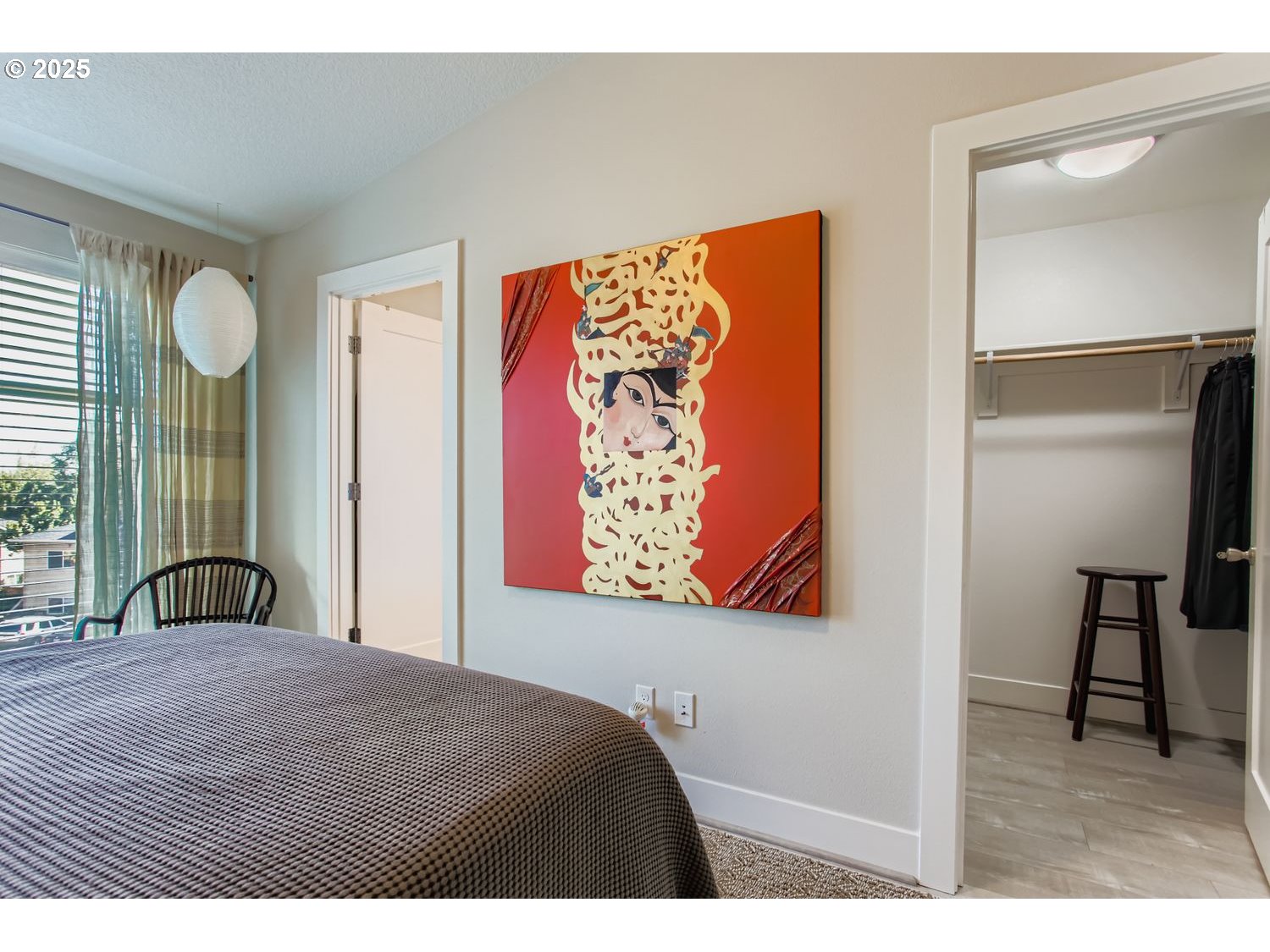 12119 Southwest Tesla Terrace Beaverton, OR 97008 - Photo 14 of 31 a bedroom with a bed and a painting on the wall