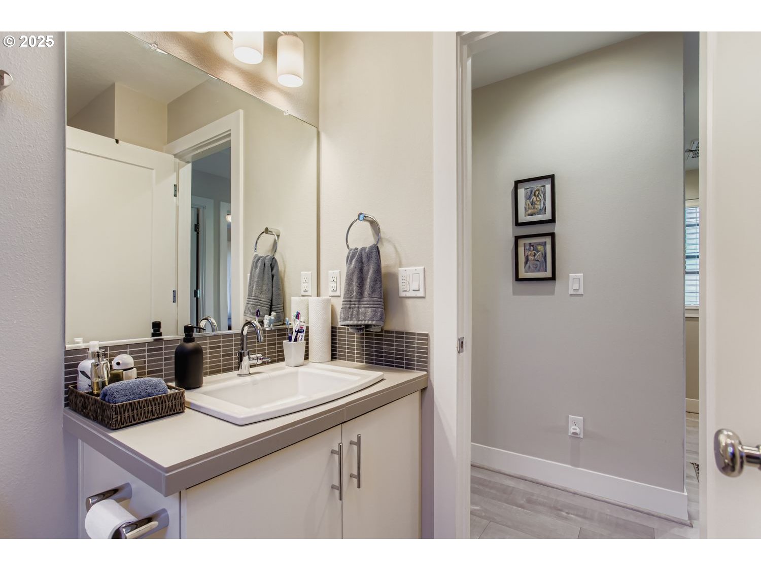 12119 Southwest Tesla Terrace Beaverton, OR 97008 - Photo 18 of 31 a bathroom with a sink and a mirror