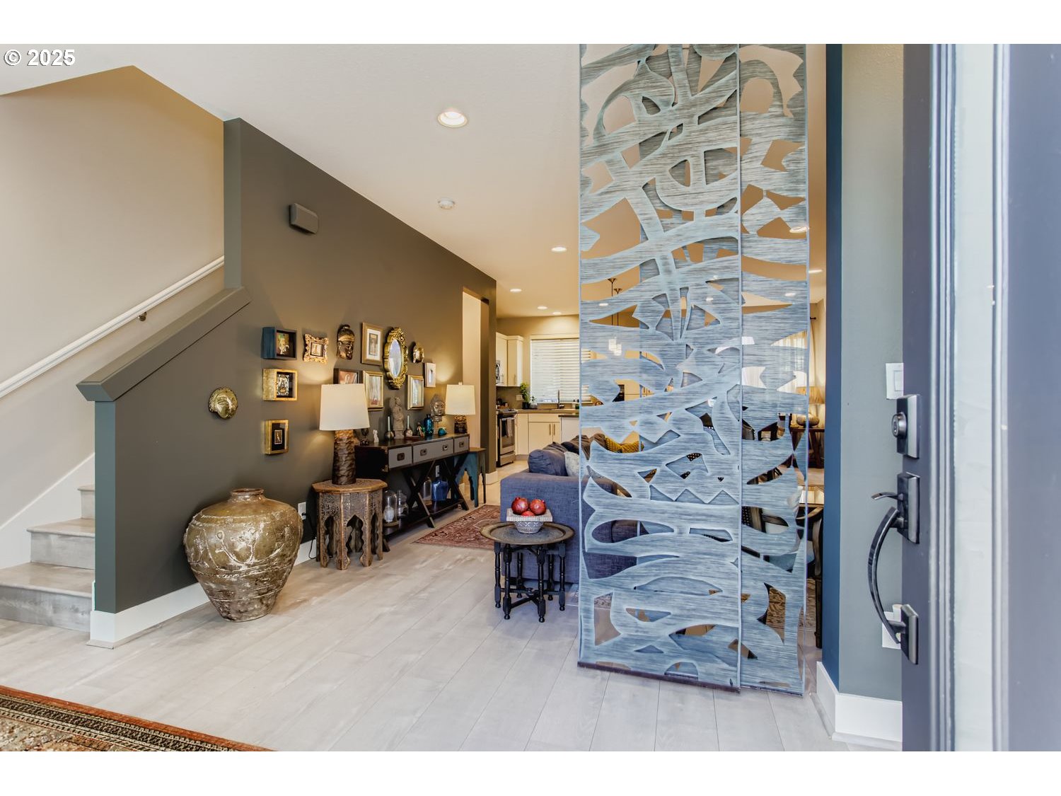 12119 Southwest Tesla Terrace Beaverton, OR 97008 - Photo 2 of 31 a bedroom with furniture and wooden floor