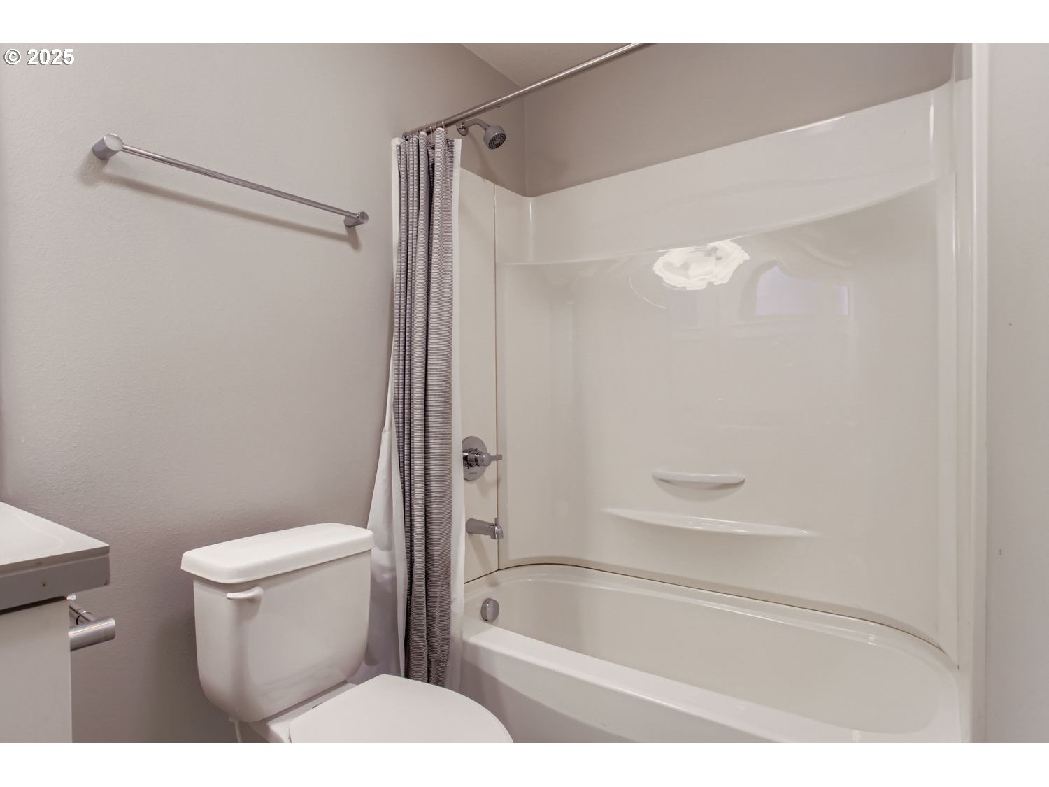 12119 Southwest Tesla Terrace Beaverton, OR 97008 - Photo 24 of 31 a bathroom with a toilet and a bathtub