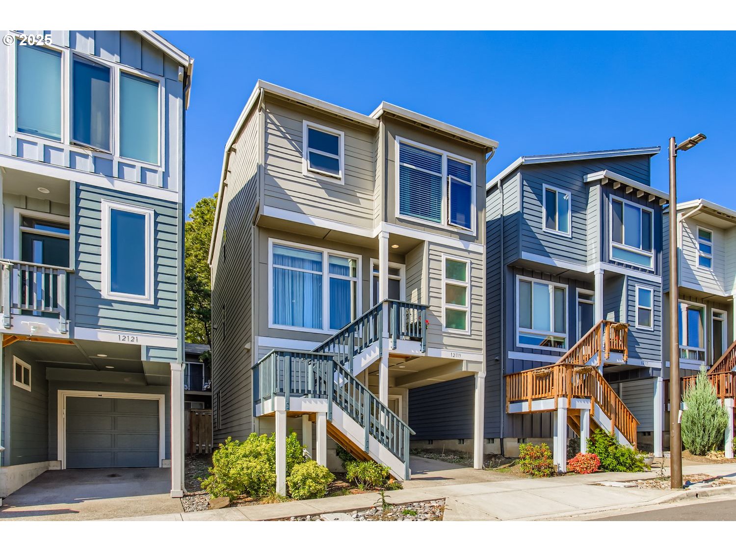 12119 Southwest Tesla Terrace Beaverton, OR 97008 - Photo 27 of 31 a front view of a house with a yard