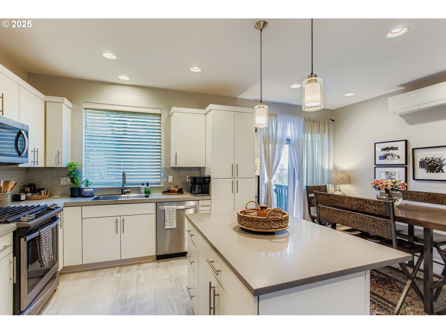 12119 Southwest Tesla Terrace Beaverton, OR 97008 - Photo 10 of 31 a kitchen with a sink a stove and cabinets