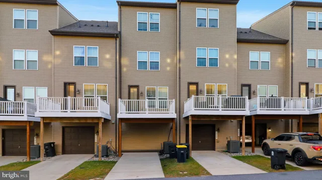 a view of a building with a window and car windows
