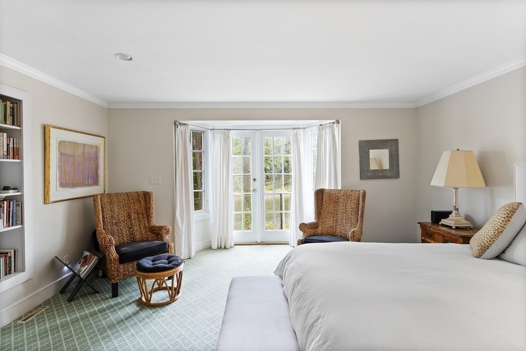 61 Cliff Road Weston, MA 02493 - Photo 16 of 28 a bedroom with a bed and a window