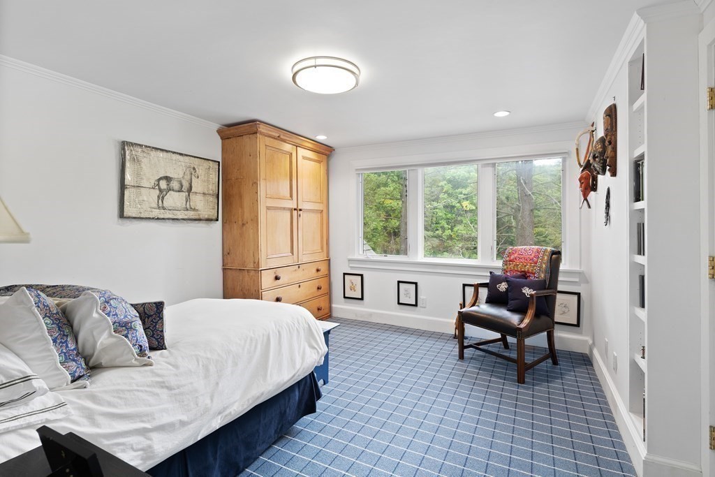 61 Cliff Road Weston, MA 02493 - Photo 22 of 28 a bedroom with furniture and a window