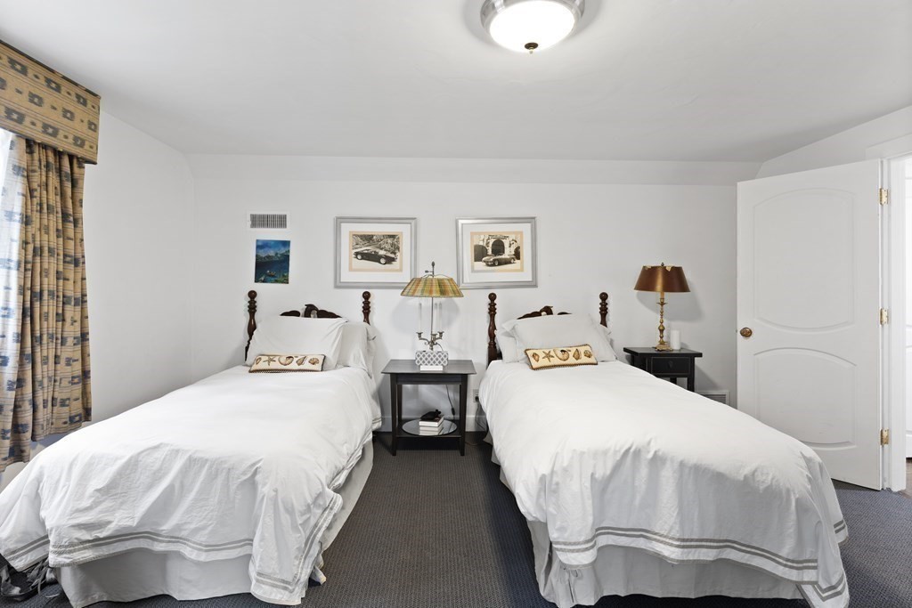 61 Cliff Road Weston, MA 02493 - Photo 23 of 28 a bedroom with bed and cupboard