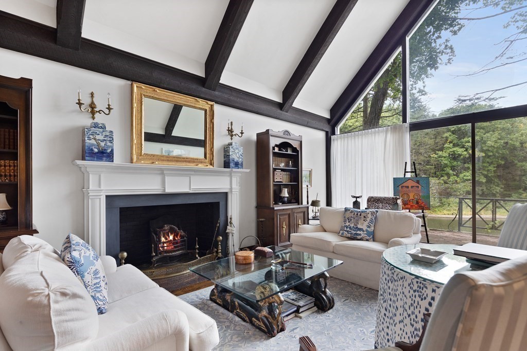 61 Cliff Road Weston, MA 02493 - Photo 6 of 28 a living room with furniture a fireplace and a large window