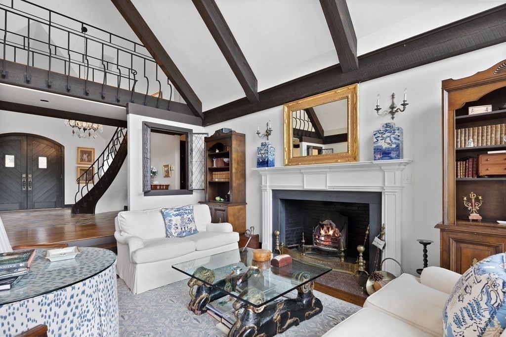 61 Cliff Road Weston, MA 02493 - Photo 7 of 28 a living room with furniture and a fireplace