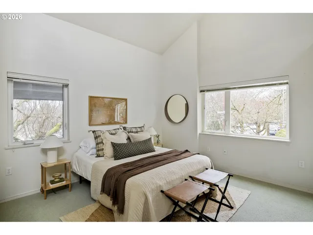 a bedroom with bed and a window