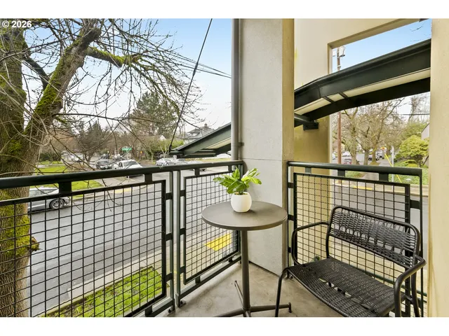 a view of a chairs and table in the balcony