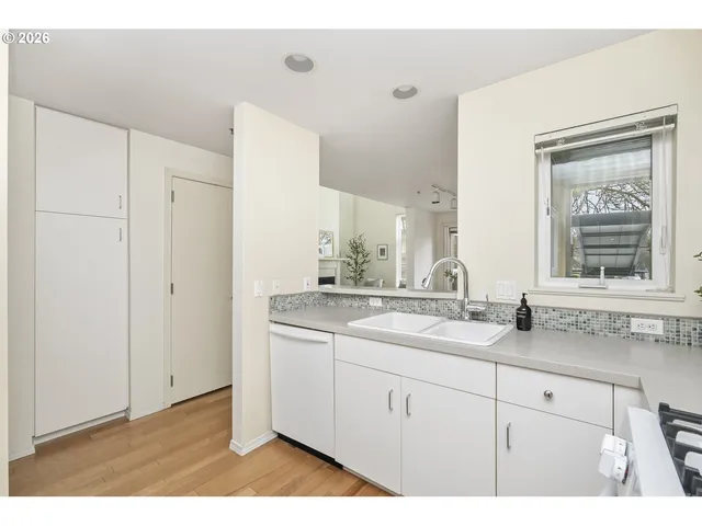 a bathroom with a granite countertop sink mirror and