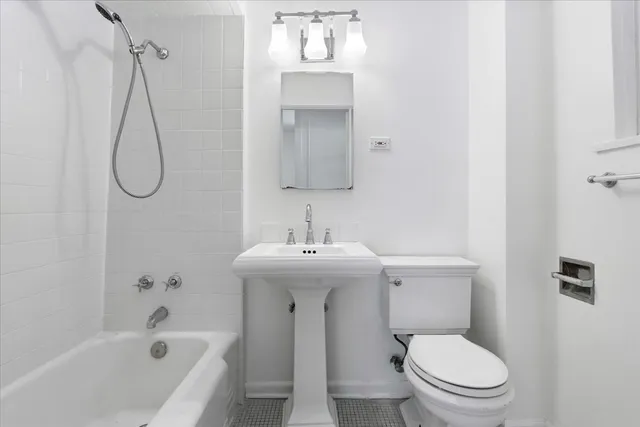a bathroom with a sink a toilet and a bathtub