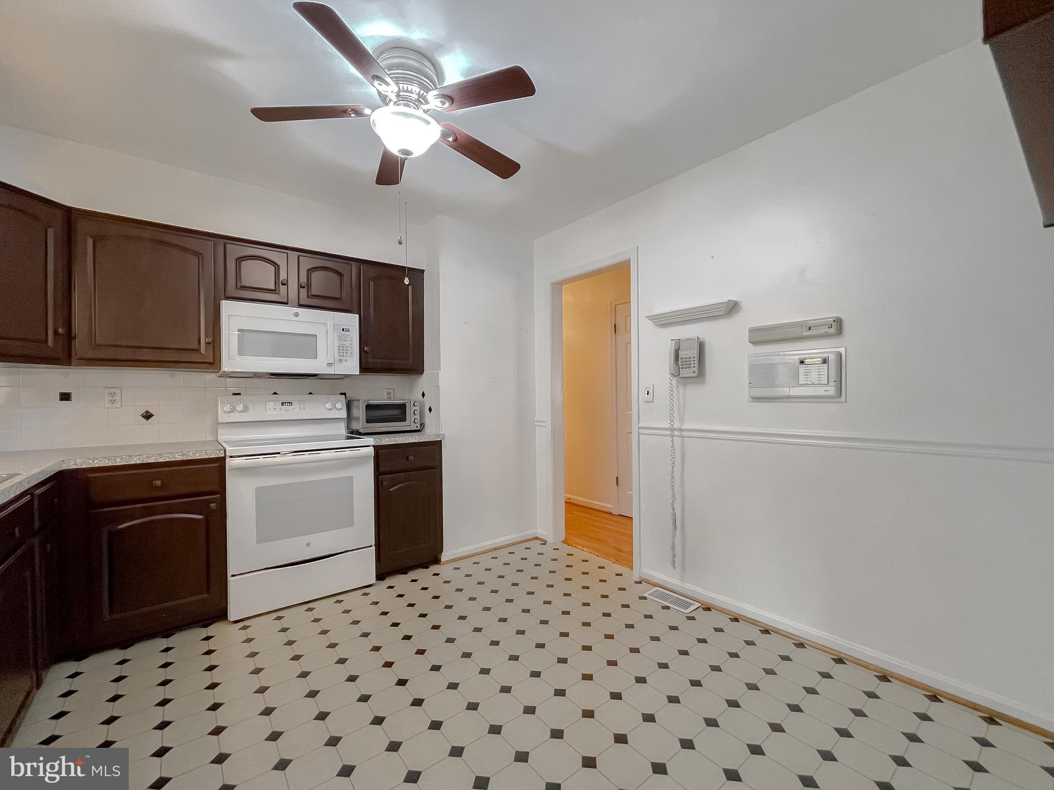7004 Vismanco Lane Clinton, MD 20735 - Photo 17 of 63 a kitchen with a refrigerator stove and sink