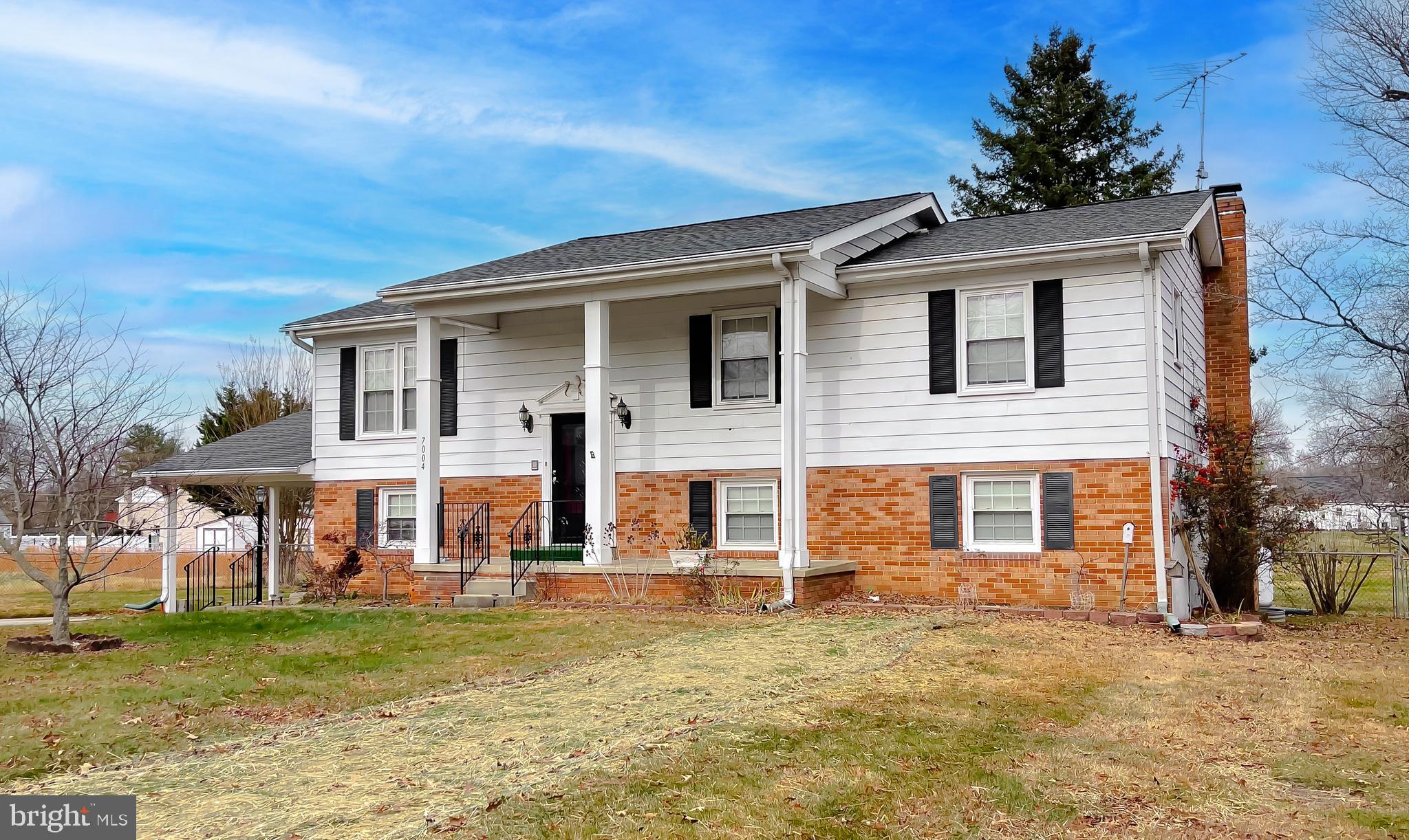 7004 Vismanco Lane Clinton, MD 20735 - Photo 2 of 63 a front view of a house with a yard