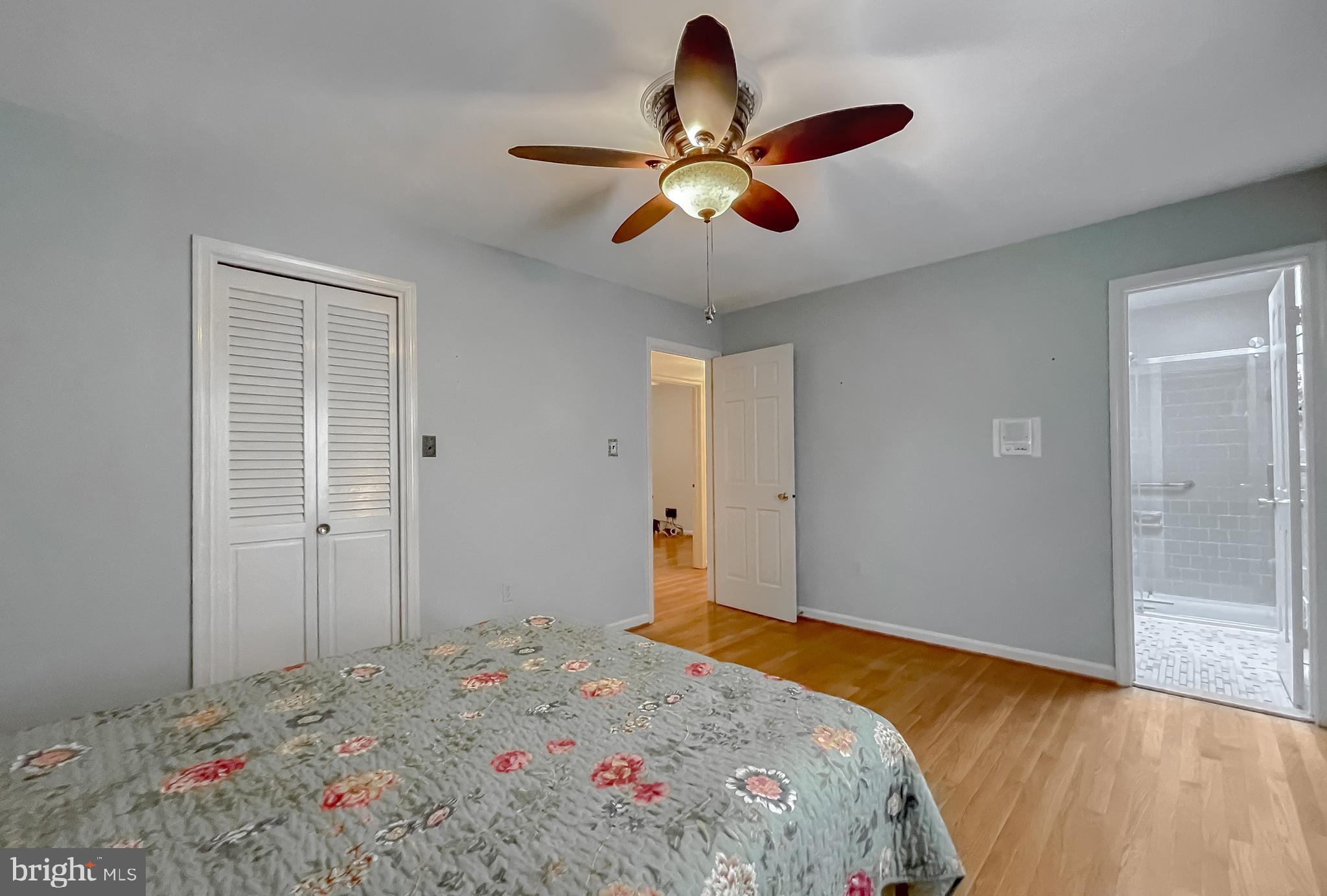 7004 Vismanco Lane Clinton, MD 20735 - Photo 24 of 63 a bedroom with a bed and a chandelier