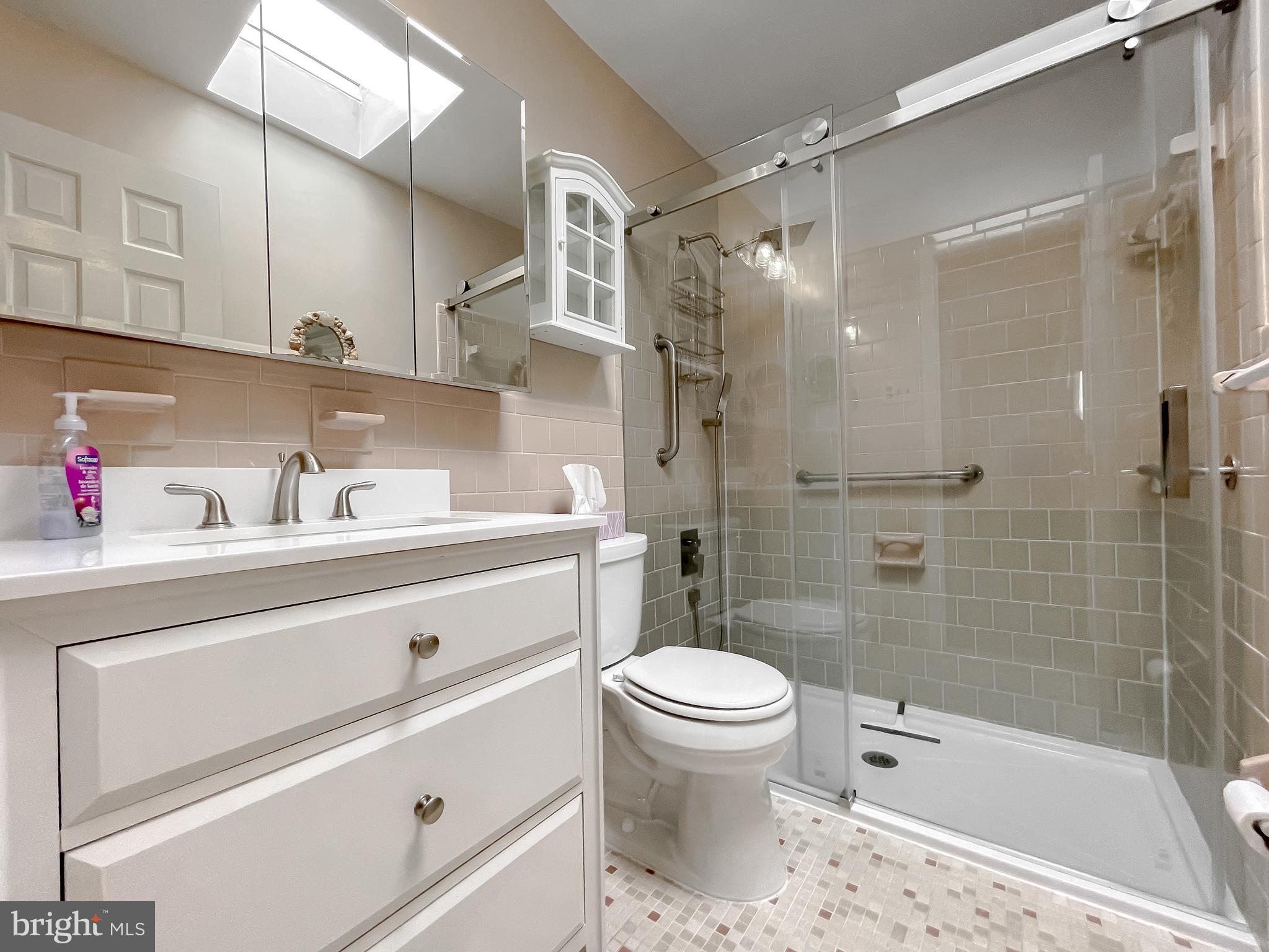 7004 Vismanco Lane Clinton, MD 20735 - Photo 26 of 63 a bathroom with a sink a toilet and shower