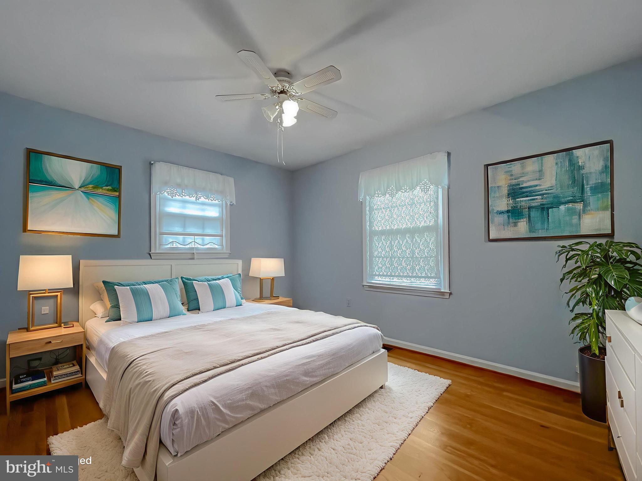 7004 Vismanco Lane Clinton, MD 20735 - Photo 29 of 63 a bedroom with a large bed and a chandelier