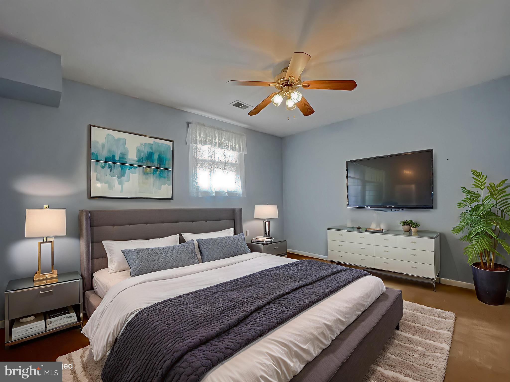 7004 Vismanco Lane Clinton, MD 20735 - Photo 33 of 63 a bedroom with a large bed and a flat screen tv