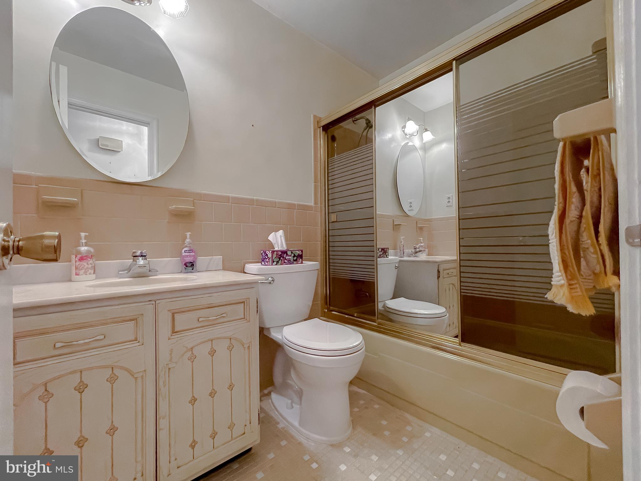 7004 Vismanco Lane Clinton, MD 20735 - Photo 35 of 63 a bathroom with a toilet sink and mirror