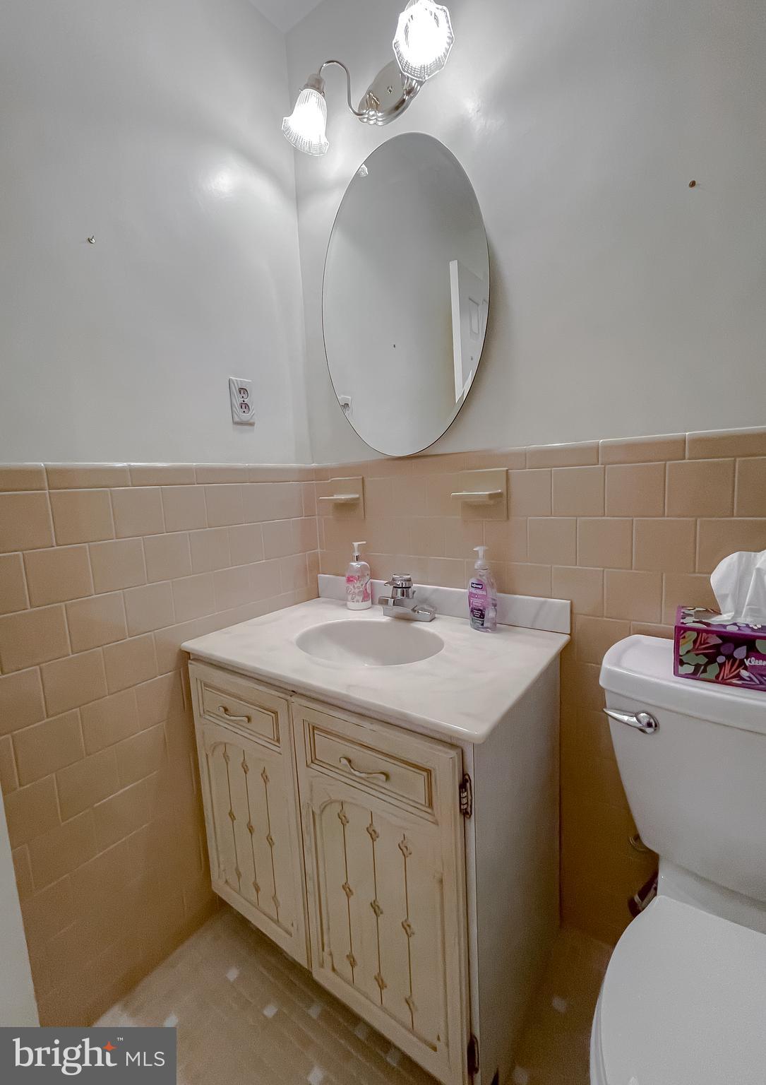 7004 Vismanco Lane Clinton, MD 20735 - Photo 36 of 63 a bathroom with a sink a toilet and a mirror