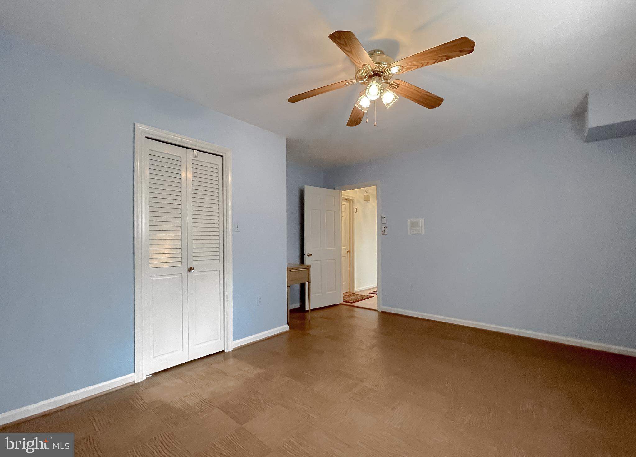 7004 Vismanco Lane Clinton, MD 20735 - Photo 51 of 63 an empty room with closet and ceiling fan