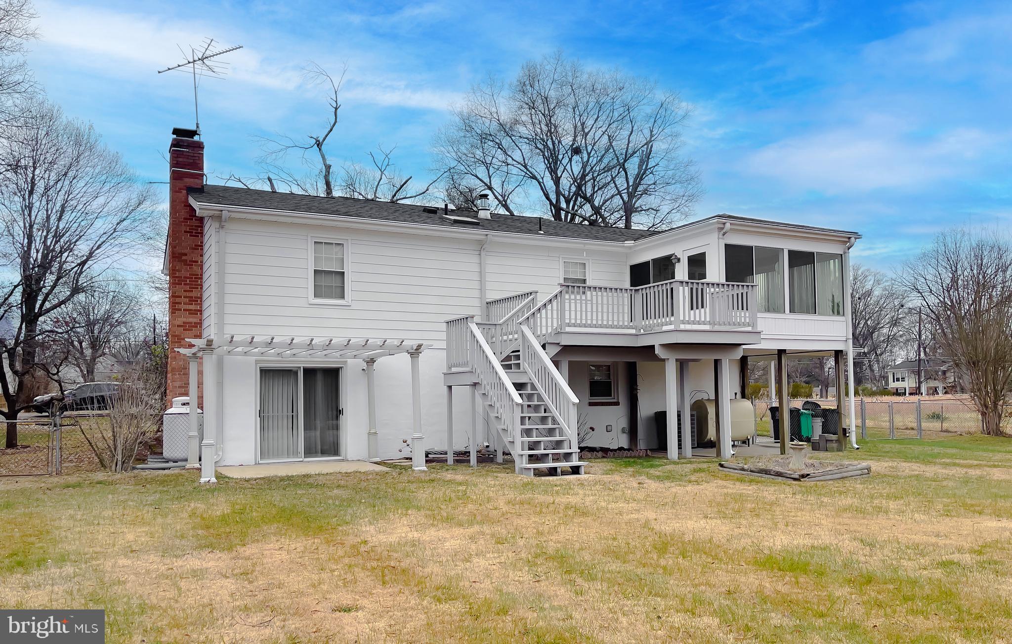 7004 Vismanco Lane Clinton, MD 20735 - Photo 58 of 63 a front view of a house with a yard