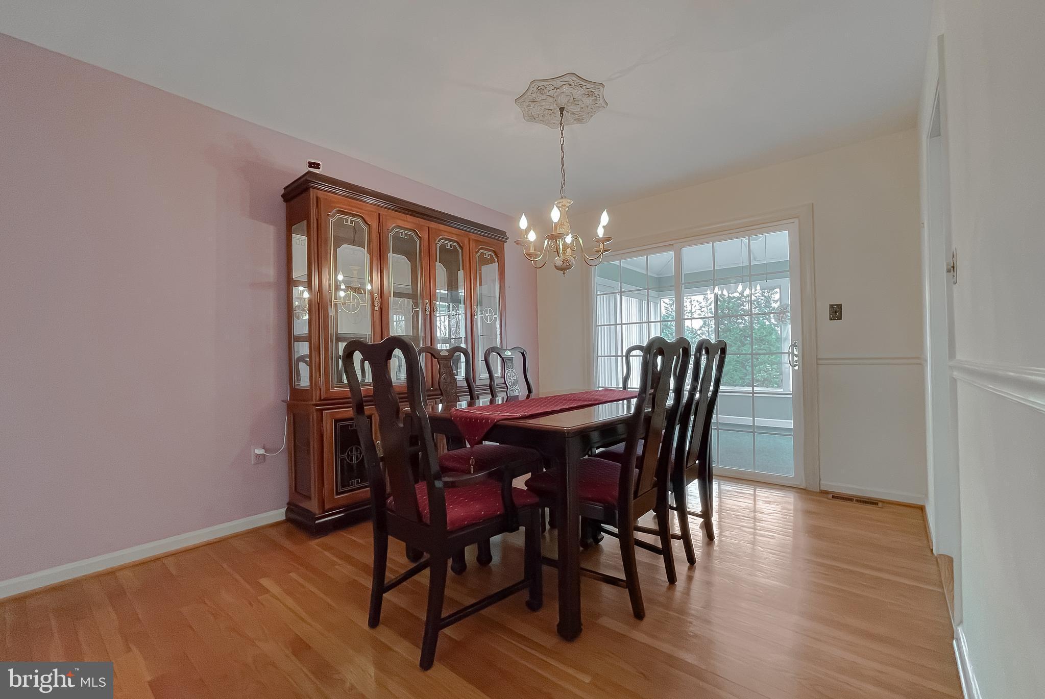 7004 Vismanco Lane Clinton, MD 20735 - Photo 9 of 63 a view of a dining room with furniture window and wooden floor
