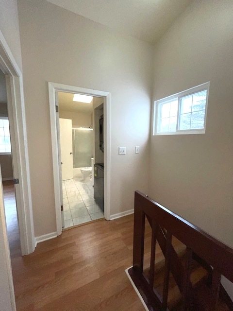 1267 Maroon Drive Elgin, IL 60120 - Photo 11 of 23 an empty room with wooden floor mirror and windows