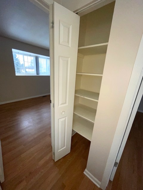 1267 Maroon Drive Elgin, IL 60120 - Photo 12 of 23 a view of an empty room with wooden floor and a window