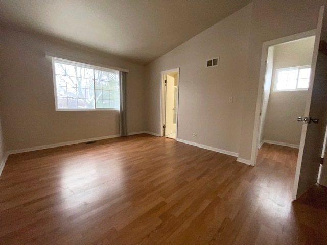 1267 Maroon Drive Elgin, IL 60120 - Photo 14 of 23 a view of empty room with wooden floor and fan