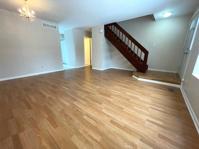 1267 Maroon Drive Elgin, IL 60120 - Photo 2 of 23 a view of an empty room with wooden floor