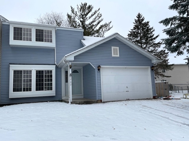 1267 Maroon Drive Elgin, IL 60120 - Photo 22 of 23 a view of a house with a yard and garage