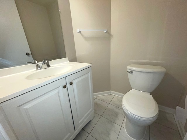 1267 Maroon Drive Elgin, IL 60120 - Photo 8 of 23 a bathroom with a toilet sink and mirror