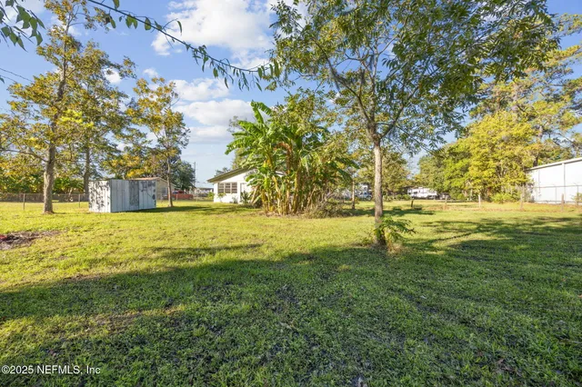 a swimming pool with an outdoor space and seating area