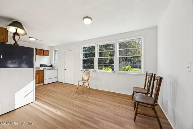 a view of kitchen with granite countertop and chair