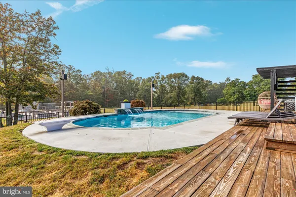 a view of a wooden deck with a yard