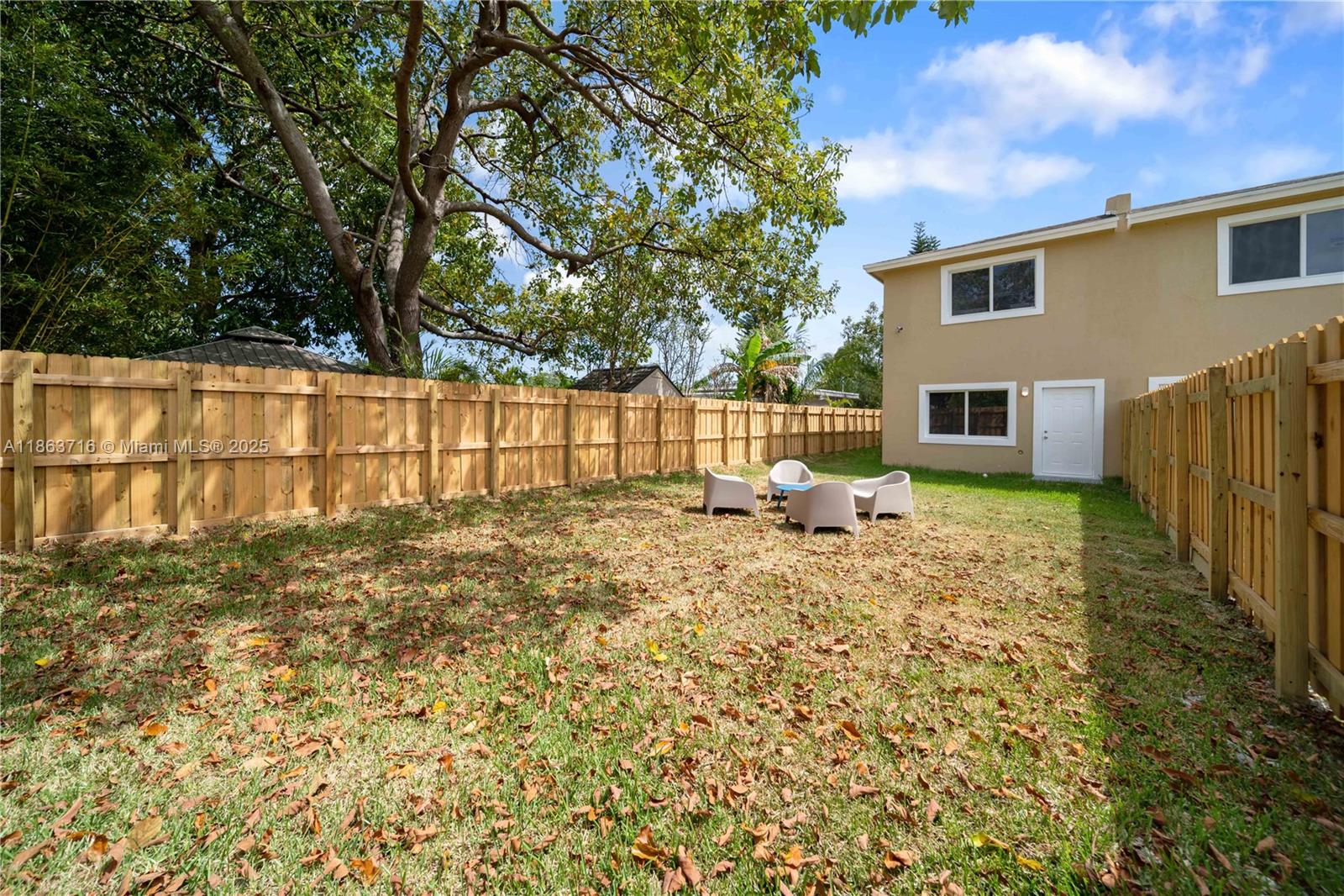 1183 Northeast 111th Street, Unit 1183 Miami, FL 33161 - Photo 2 of 20 a front view of a house with a yard