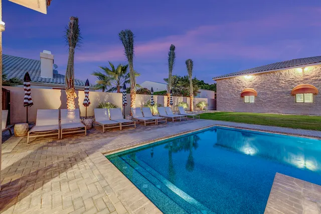 a view of a big house with a big yard