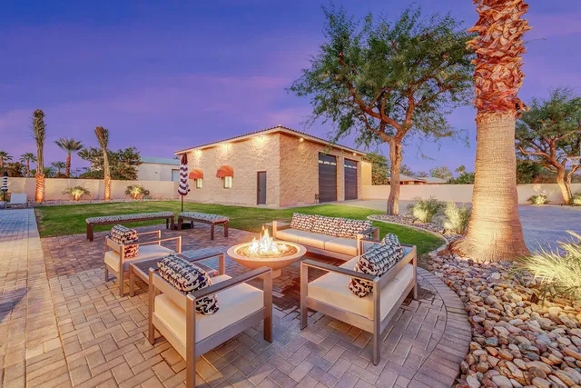 a view of a dining room with furniture wooden floor and chandelier