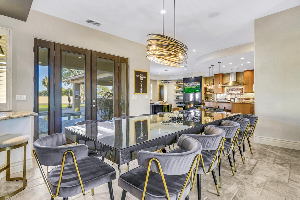 41370 Sparkey Way Bermuda Dunes, CA 92203 - Photo 30 of 82 a view of a dining room with furniture wooden floor and chandelier