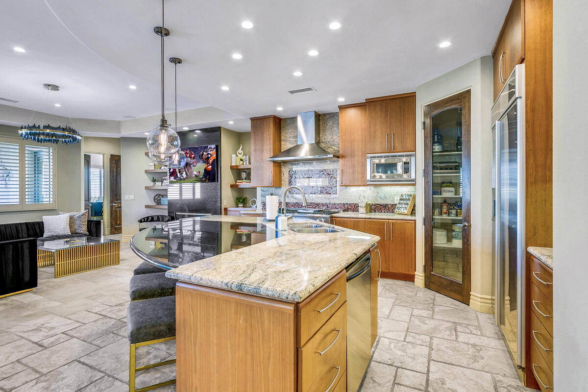41370 Sparkey Way Bermuda Dunes, CA 92203 - Photo 33 of 82 a kitchen with stainless steel appliances granite countertop a refrigerator a oven and a sink