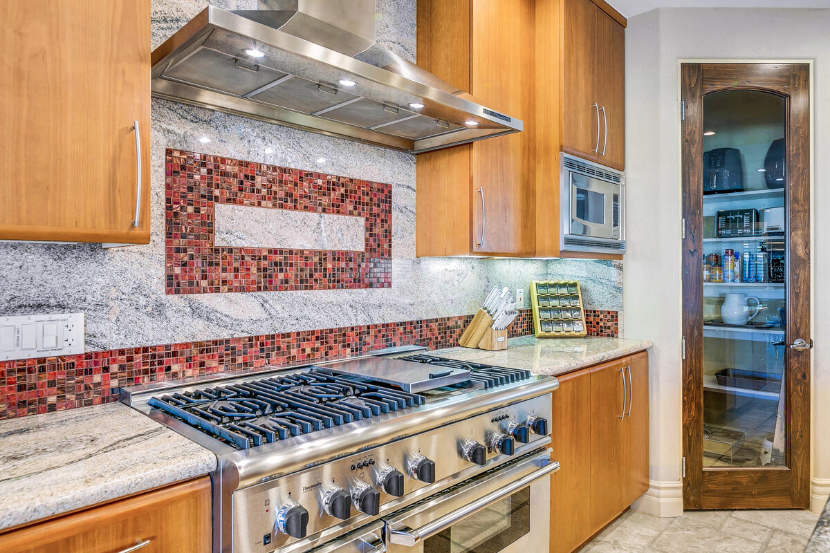 41370 Sparkey Way Bermuda Dunes, CA 92203 - Photo 35 of 82 a room with stainless steel appliances granite countertop a stove and cabinets