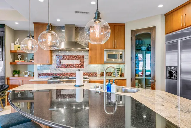 a dining room with lots of wooden furniture and a rug