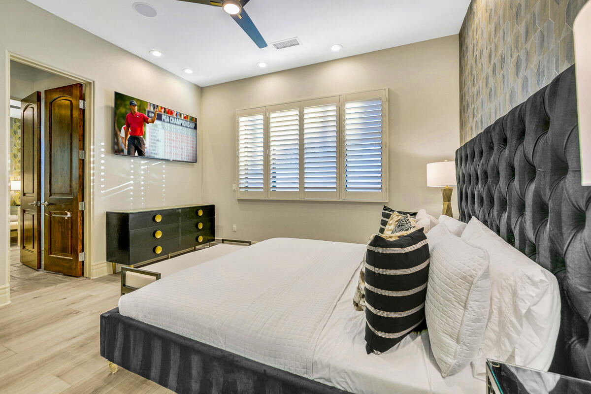 41370 Sparkey Way Bermuda Dunes, CA 92203 - Photo 59 of 82 a bedroom with a bed and dresser with wooden floor