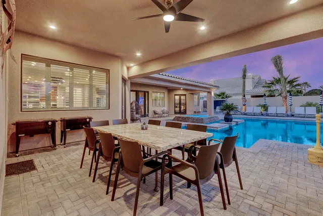 a bed sitting in a room next to a window