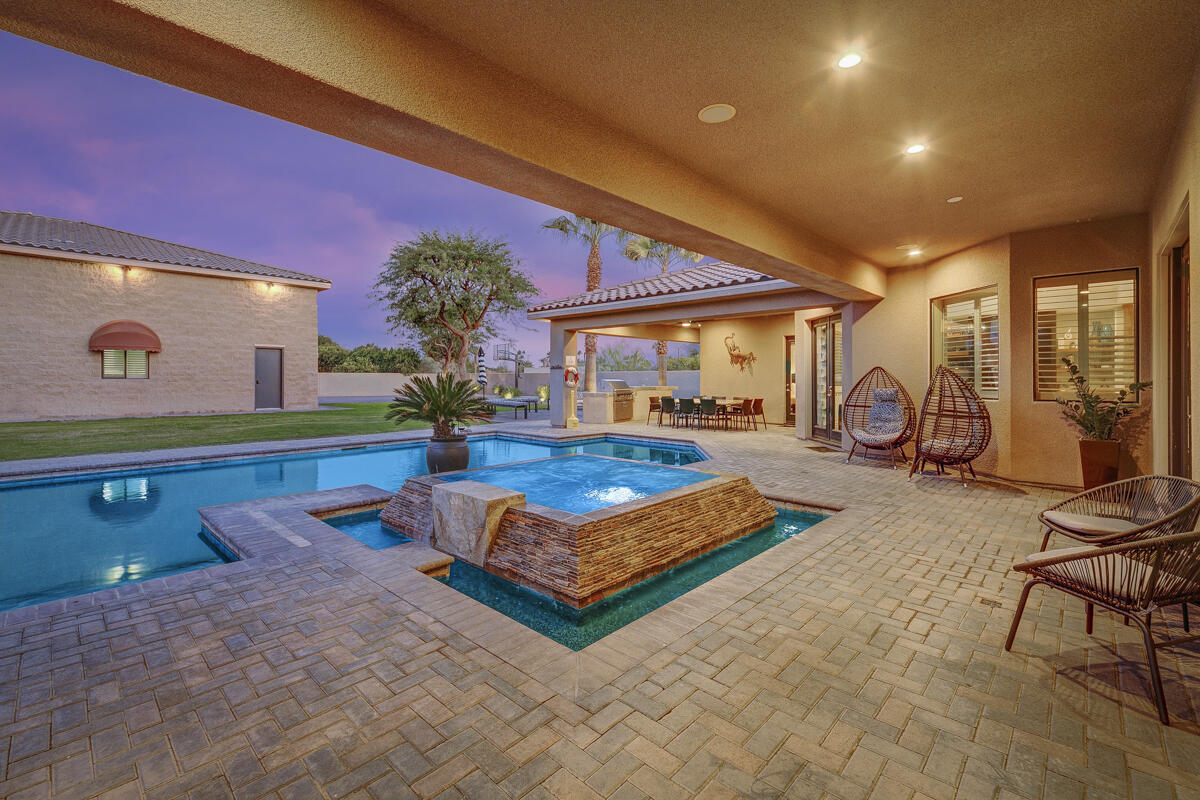 41370 Sparkey Way Bermuda Dunes, CA 92203 - Photo 10 of 82 a living room with furniture pool table and a floor to ceiling window